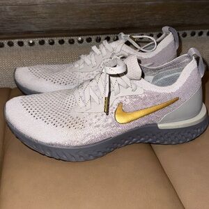 Nike Women's Sneakers -  epic react White and Gold